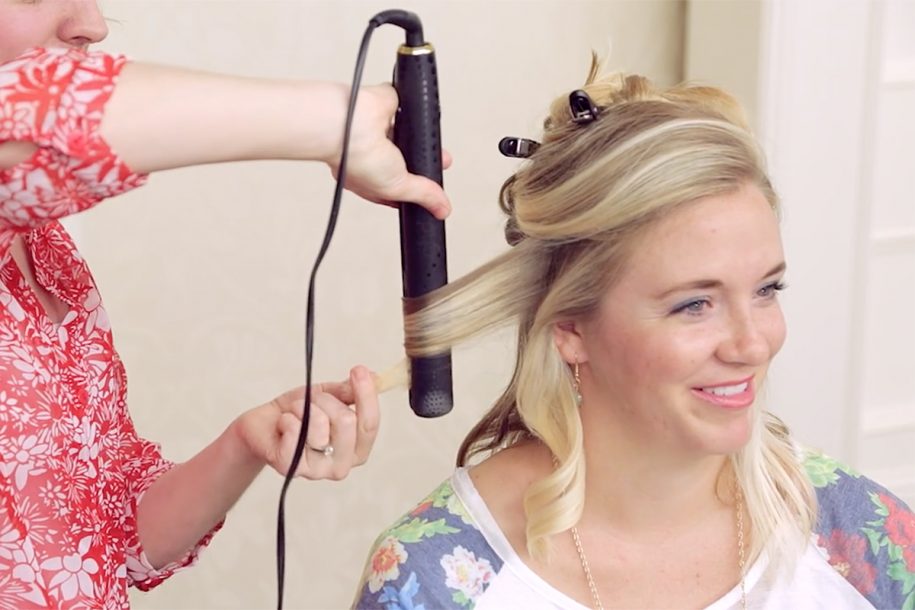 Demonstration on how to use a flat iron to get curls