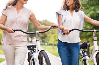 Two women riding bikes - Type 2 lifestyle tips