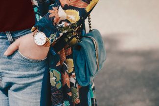 Woman carrying blue shoulder bag