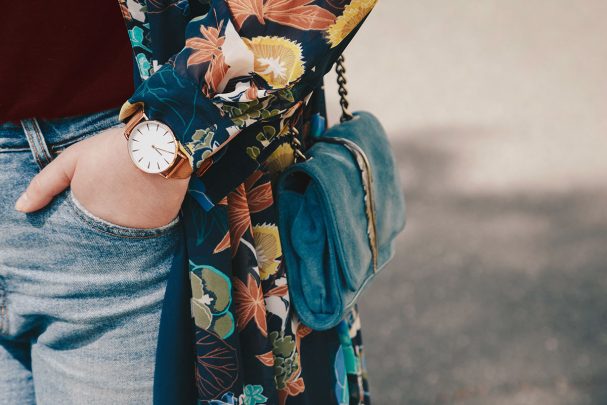 Woman carrying blue shoulder bag