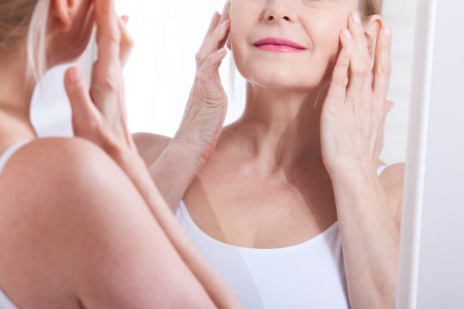 Woman looking in mirror