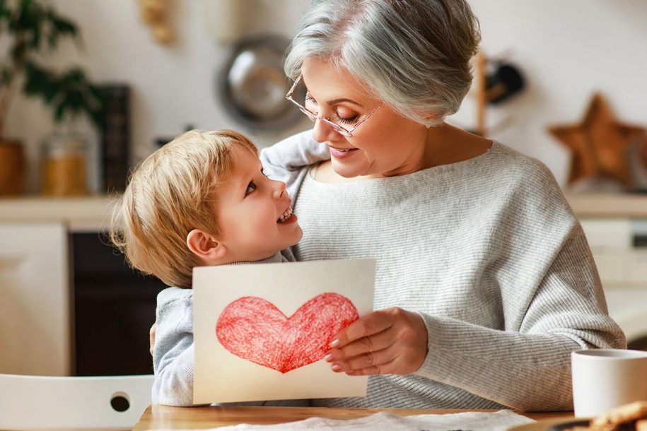 Grandma sitting with grandson at a table - what Type of Grandma are you